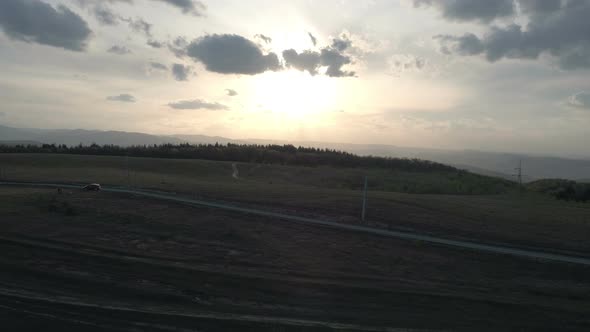 Aerial view of a field and a countryside road