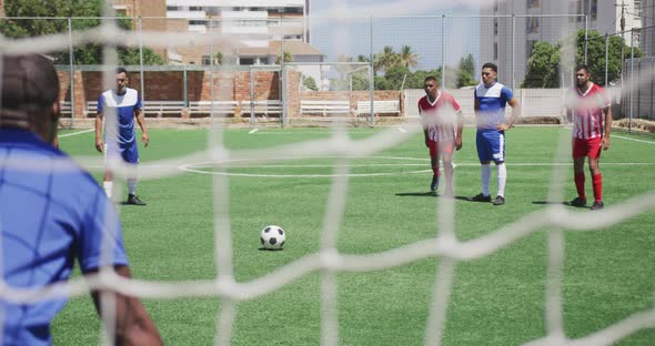 Soccer players having match on field