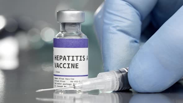Hepatitis A vaccine vial in medical lab with syringe