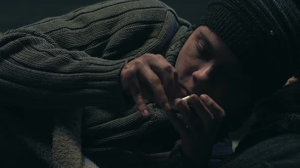 Irritated Homeless Man Fails to Light Cigarette, Addiction to Smoking, Closeup