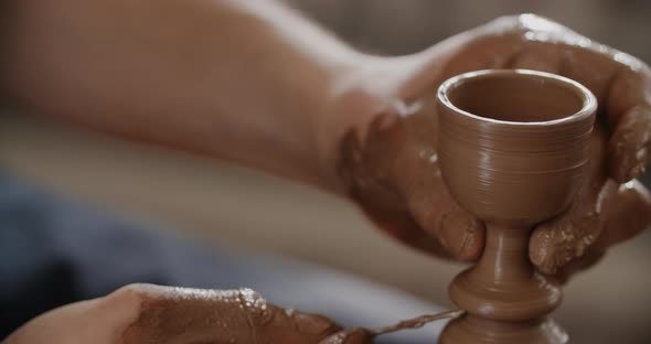 Potter Sculpts a Small Ceramic Glass in Slow Motion on a Potter's Wheel Small Forms in Pottery