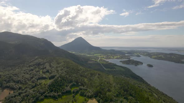 Cone-shaped Jendemsfjellet mountain next to Haroy fjord, Norway