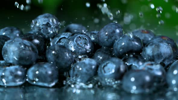 Super Slow Motion Shot of Water Falling on Fresh Blueberries at 1000Fps