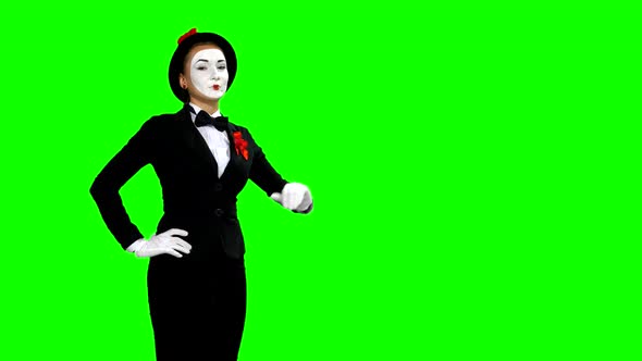Funny Woman Mime Shows and Speaks About Something on Green Screen
