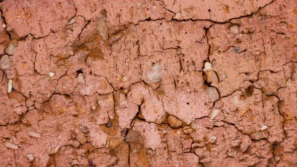 Texture of Cracked Red Old Brick Closeup