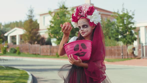 Girl in Halloween Costume Posing for Camera