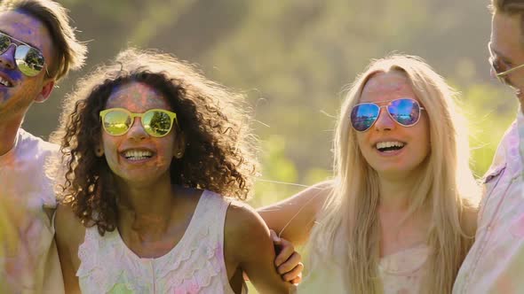 Young Friends Hanging Out at Open-Air Holi Festival, Dancing Full of Euphoria