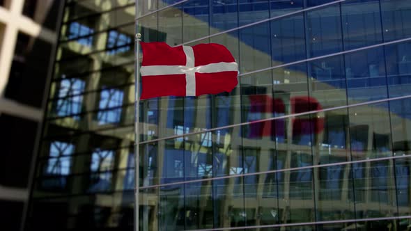 Sovereign Military Order of Malta Flag Waving On A Skyscraper Building