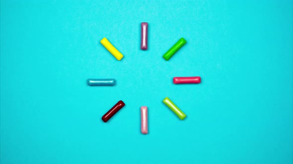 Colored Candy Sticks Appear in a Circle and Blink. Colorful Loading Sign From Candies. Stop Motion