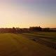 Aerial Cinematic Clip Drone Flying Over a Farm Field During Sunset - VideoHive Item for Sale