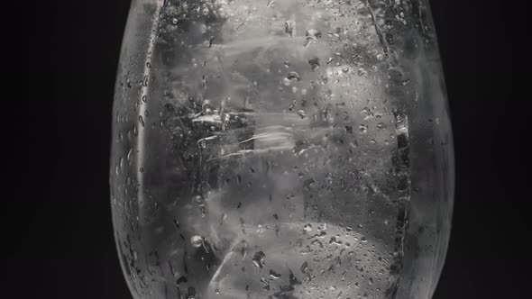 Ice Water Bubbling Inside Glass Closeup