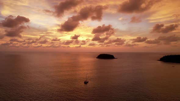 Luxury Yacht at Sunset with a View of the Island