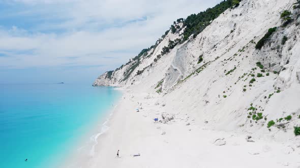 Drone view of scenic beach with white sand and turquoise sea, Greek islands.