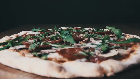 Appetizing Pizza on a Wooden Board in a Restaurant