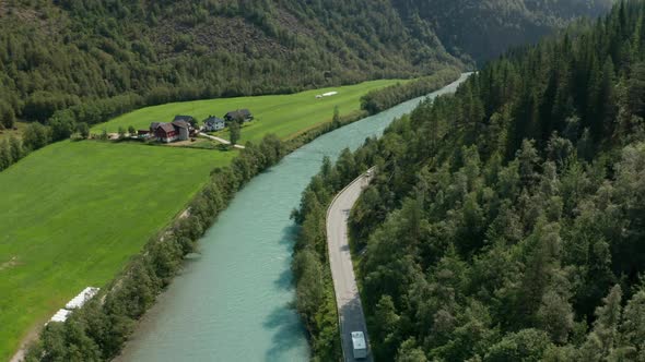 Drone Rising Over River And Road