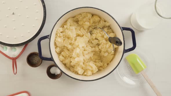 Step by step. Preparing classic mashed potatoes for Thanksgiving dinner.