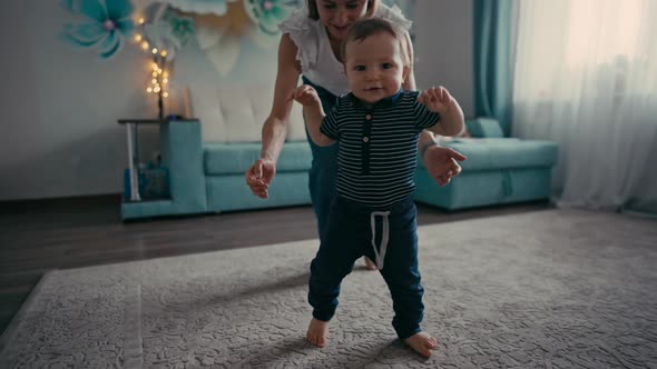 Cute Smiling Baby Boy Learning to Walk