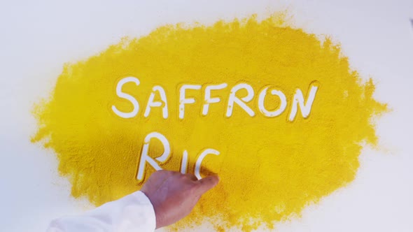 Hand Writes On Turmeric Saffron Rice