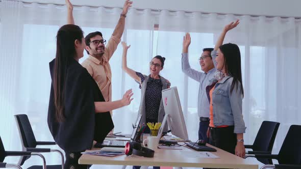 Successful Business People Celebrating Project Success at Office