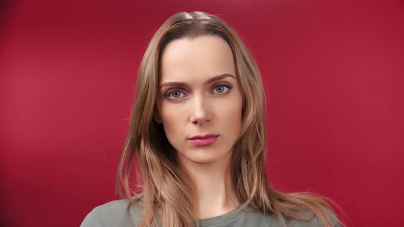 Closeup Portrait of Confused Frowning Face Beautiful Woman Looking at Camera Isolated