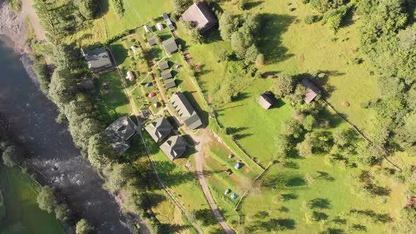 Aerial View of the Ukrainian Camping with Wooden Houses in the Summer Carpathian