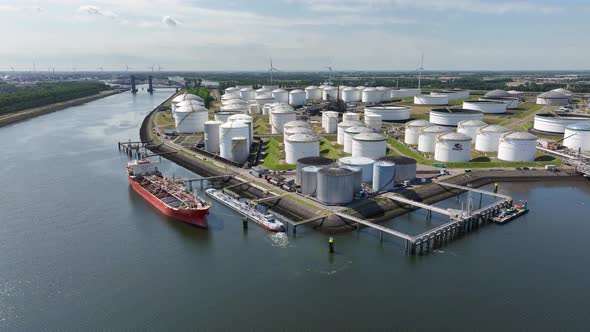 Liquid Cargo Transporter Ship Unloading Crude Oil to a Fuel Depot