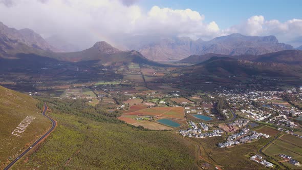 Flight along Franschhoek pass showing the town, vineyards on farms and mountains