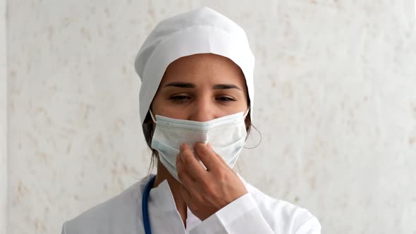 A Nurse with a Mask During a Coronavirus Pandemic. Close in Slow Motion