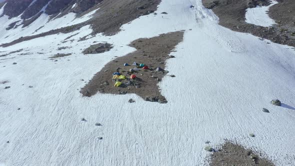 Tent Camp in the Snow-capped Mountains of the Caucasus near the Khoduk Pass