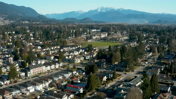 Aerial drone view over a scenic mountainside town.