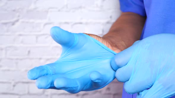 Man Doctor Wears Medical Gloves, Close Up