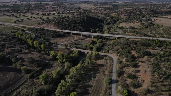 Roman bridge at Vila Formosa and surrounding rural landscape, Portugal. Aerial forward