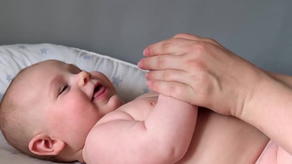 Mother Giving Massage To Little Child