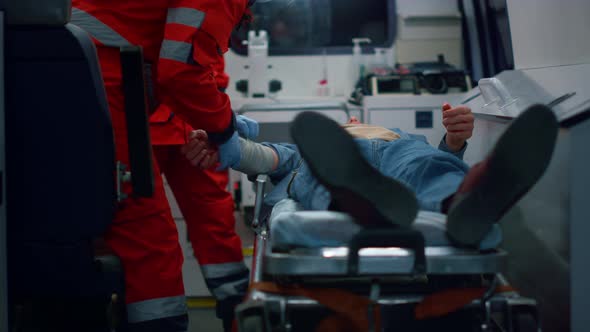 Paramedics Proving First Aid to Patient