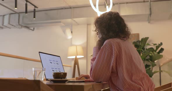 Woman orders food, clothes in an online store using a computer. Delivery at lockdown concept.