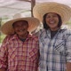Happy Asian woman farmers looking to camera and laughing together on local organic vegetable farm. - VideoHive Item for Sale