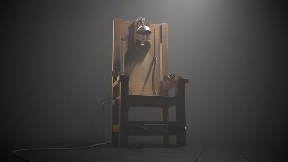 Wooden electric chair in the foggy room spotlight. Camera slow pan. 4K HD