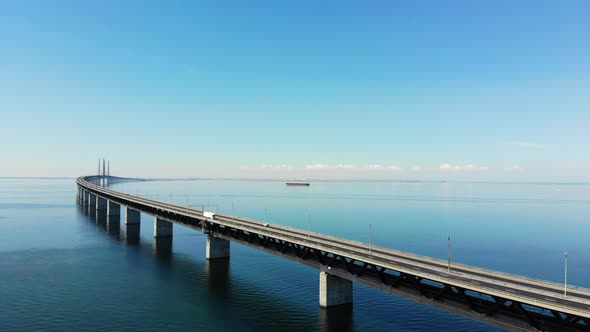 Drone flying forward, upward to get a nice view of the Oresund bridge, summer time