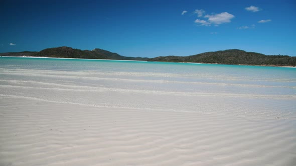 Whitehaven Beach with Small Waves on the Shoreline on a Sunny Day