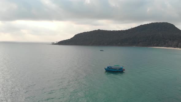 Boat on calm tropical sea off Lazy Beach, Koh Rong Samloem. Holidays in Paradise