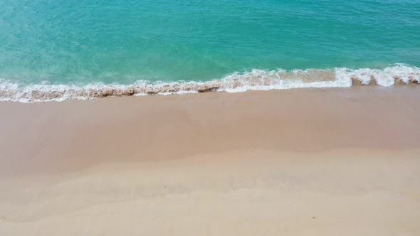 Aerial  View Wave Swept On The White Sand Beach.