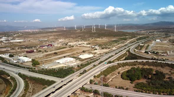 Aerial View Over the Farm Landscape and Wind Turbines Generating Clean Renewable Energy