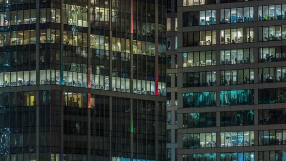 Close Up View to Office Windows in Skyscrapers of City at Night Timelapse From Top