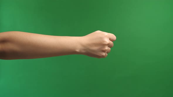 Woman's Hands With Fist Gesture On Green Screen Background