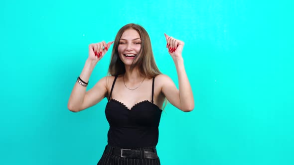 The Teenager Dances with Her Hands and Has Fun After Finishing Her School Year