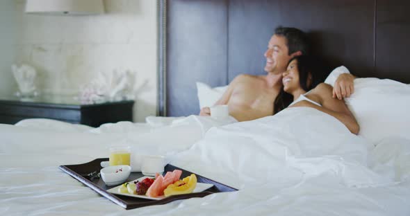 Couple Enjoying Breakfast in Bed