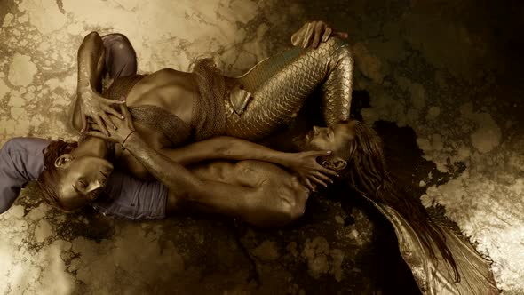 Handsome Man is Hugging His Waternymph Girlfriend Fairytale Lovers in Golden Water