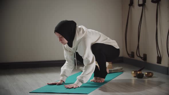 Yoga  Strong Woman in Hijab Doing Exercises on Yoga Mat with Leaning on Her Hands