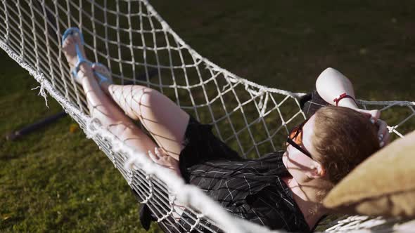 Woman Chills in the Hammock on the Sunset, Vacation and Relaxing, Nature and Recreation