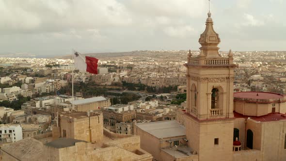 Beautiful Gozo Sand Castle Fort with Malta Flag Waving Revealing Countryside of Gozo Island, Aerial